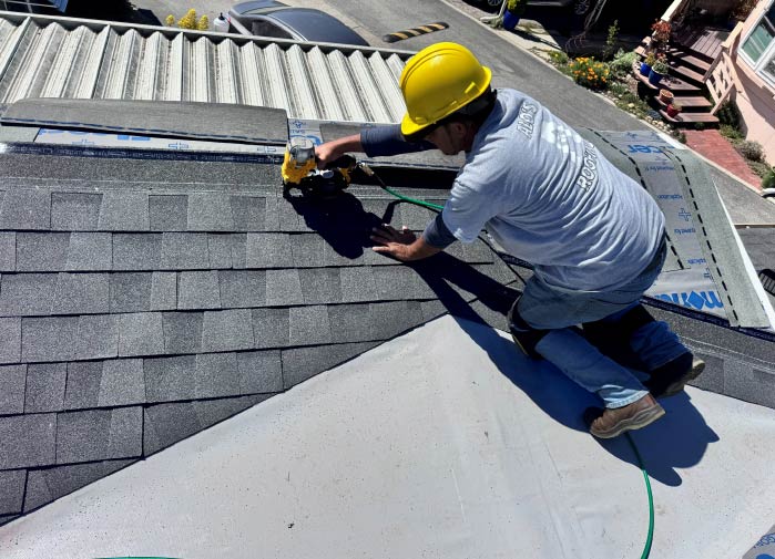 residential roofer installing shingles